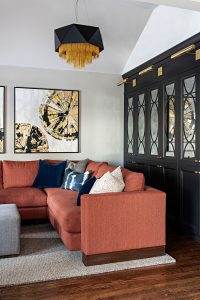 Interior Design Orange Sectional with Blue Accent Pillows